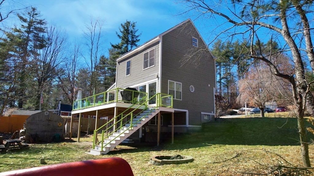 68 Meadow Cart Way Millis, MA 02054 - Photo 22 of 28 a front view of a house with garden