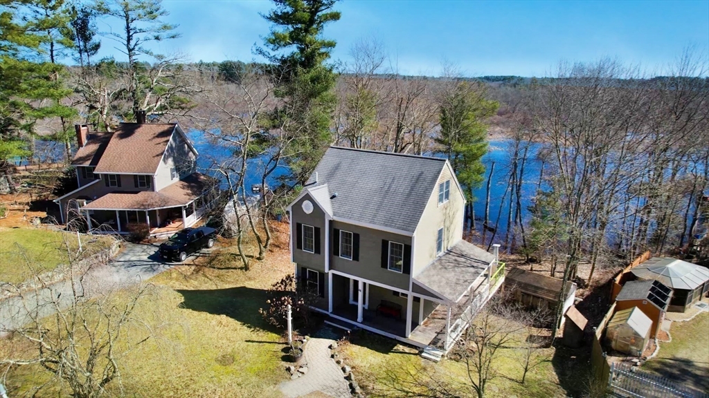 68 Meadow Cart Way Millis, MA 02054 - Photo 3 of 28 an aerial view of a house with a yard covered with snow in the outdoor
