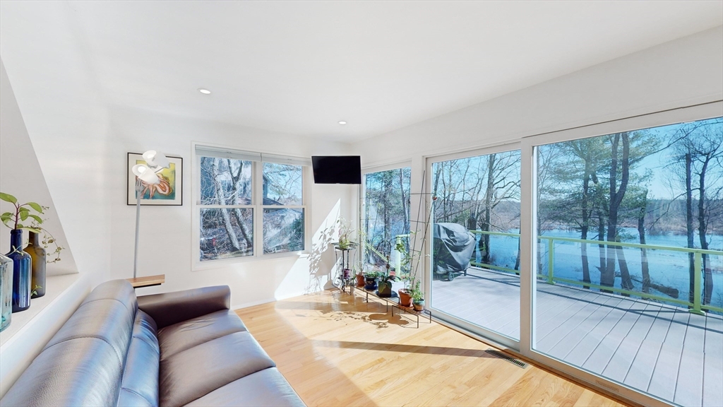 68 Meadow Cart Way Millis, MA 02054 - Photo 5 of 28 a living room with furniture and a floor to ceiling window