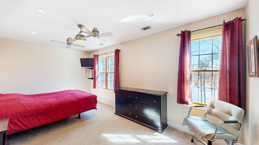 68 Meadow Cart Way Millis, MA 02054 - Photo 9 of 28 a living room with furniture and a fireplace