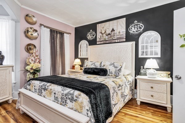 11 Cambridge Street Lawrence, MA 01843 - Photo 11 of 40 a bedroom with a bed and a window