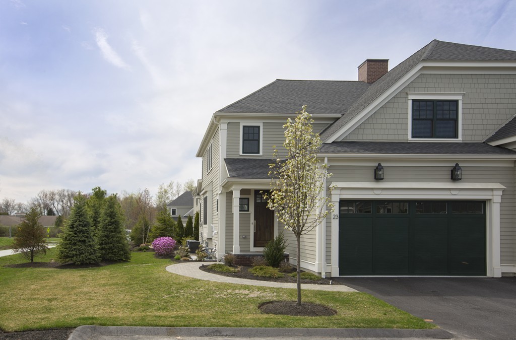 23 Lillian Way, Unit 28 Wayland, MA 01778 - Photo 2 of 16 a front view of a house with a yard
