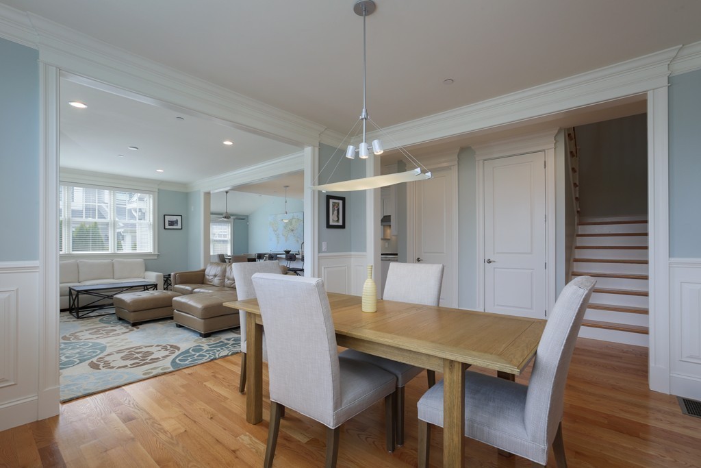 23 Lillian Way, Unit 28 Wayland, MA 01778 - Photo 5 of 16 a view of a dining room with furniture window and wooden floor