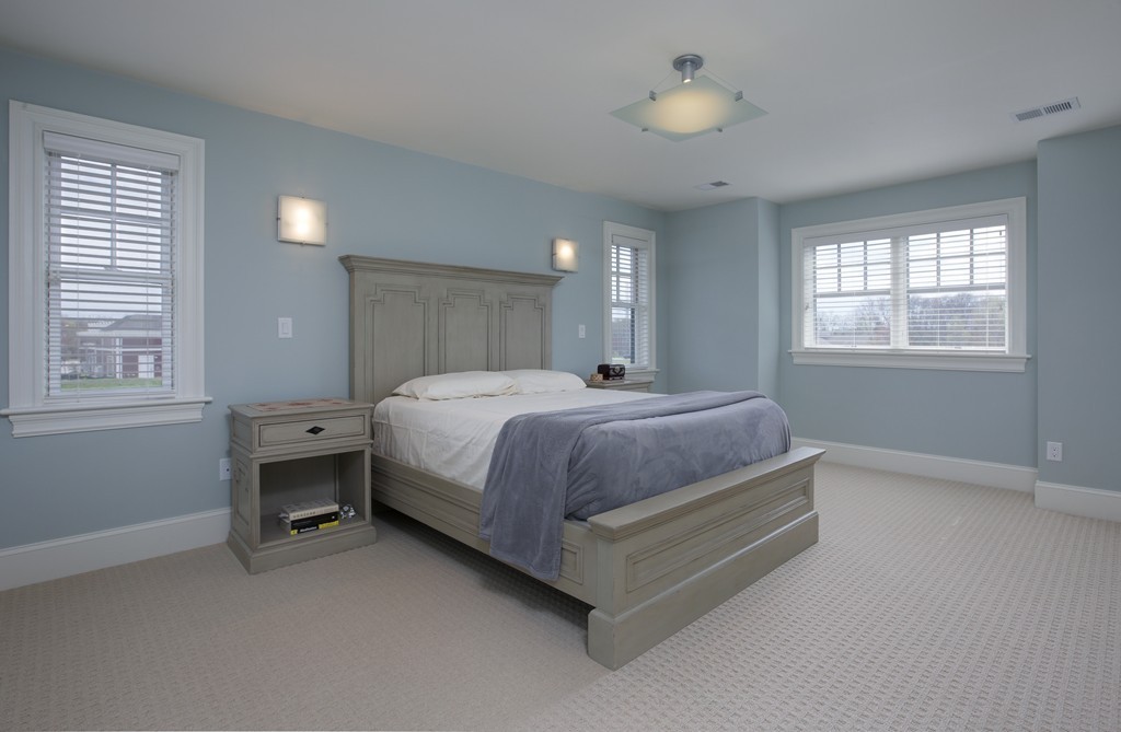 23 Lillian Way, Unit 28 Wayland, MA 01778 - Photo 6 of 16 a bedroom with a bed and a window
