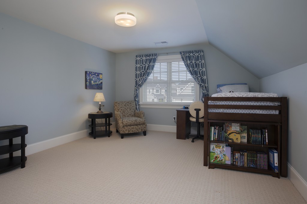 23 Lillian Way, Unit 28 Wayland, MA 01778 - Photo 9 of 16 a living room with furniture and a fireplace