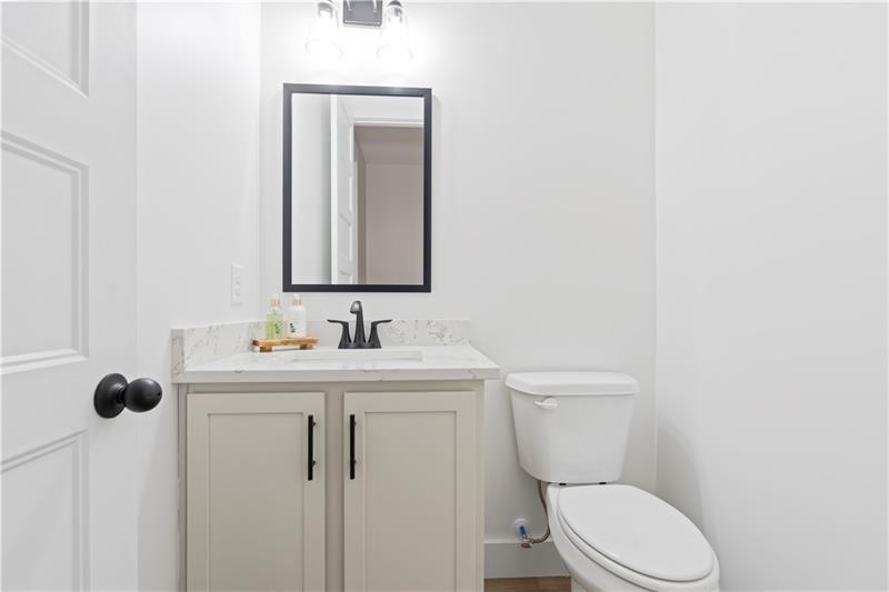 160 Old Sandhill Road Carrollton, GA 30116 - Photo 22 of 39 a bathroom with a toilet sink and mirror