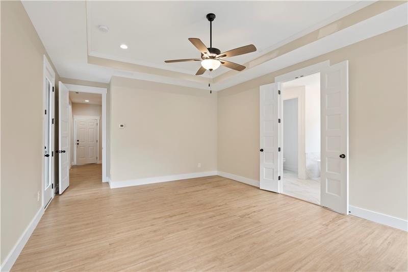 160 Old Sandhill Road Carrollton, GA 30116 - Photo 31 of 39 wooden floor in an empty room with a fan