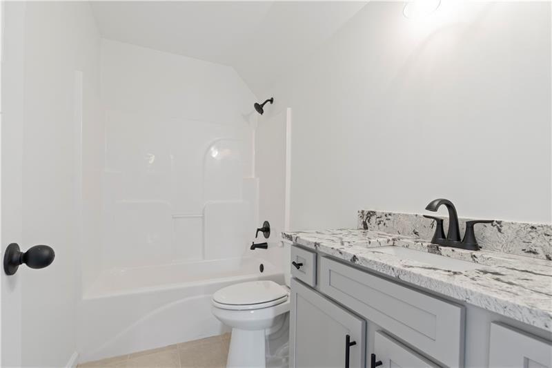 160 Old Sandhill Road Carrollton, GA 30116 - Photo 33 of 39 a bathroom with a sink a toilet and shower
