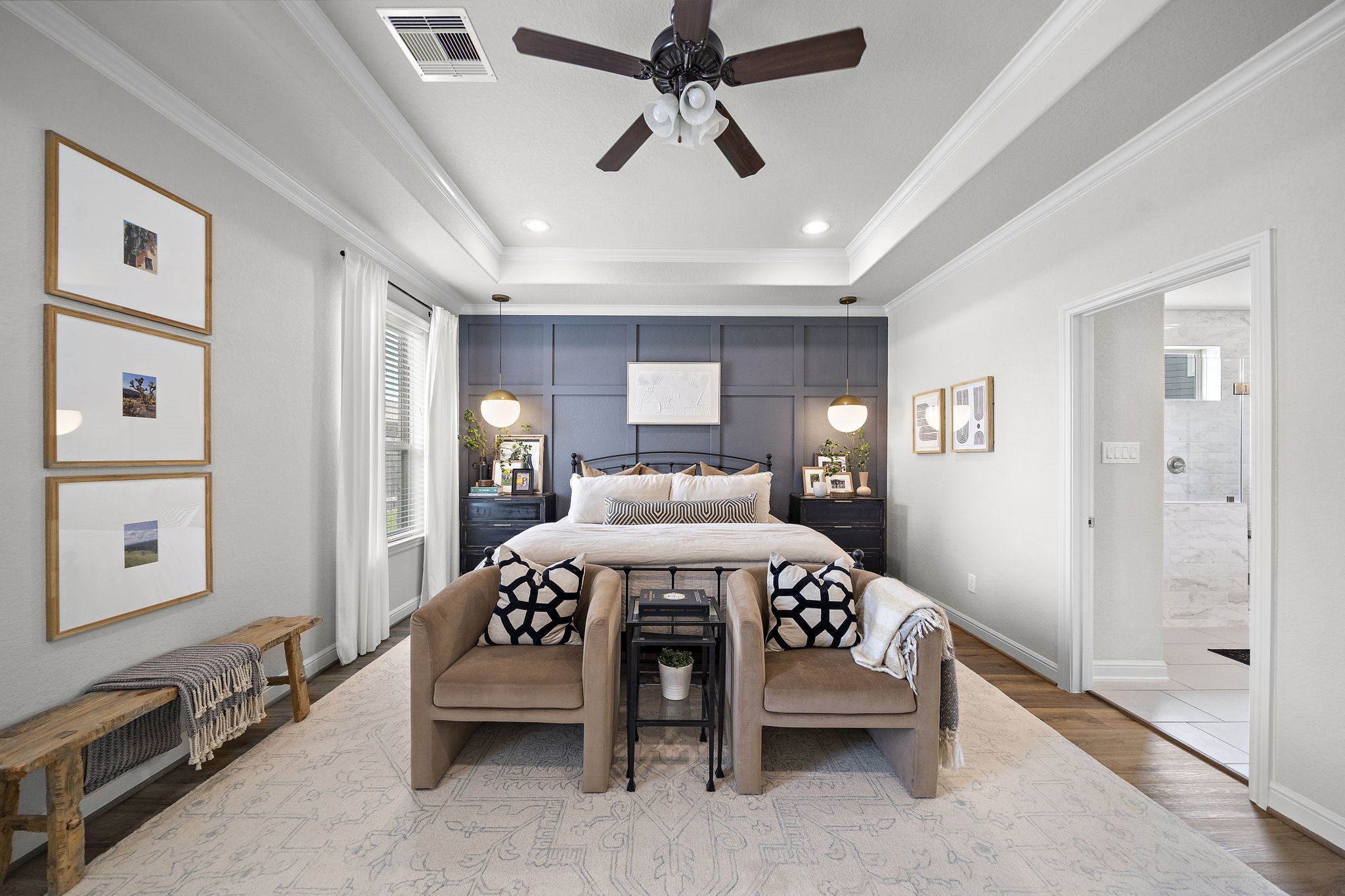 19103 Heather Downs Court Cypress, TX 77429 - Photo 19 of 35 a bedroom with a bed and a chandelier