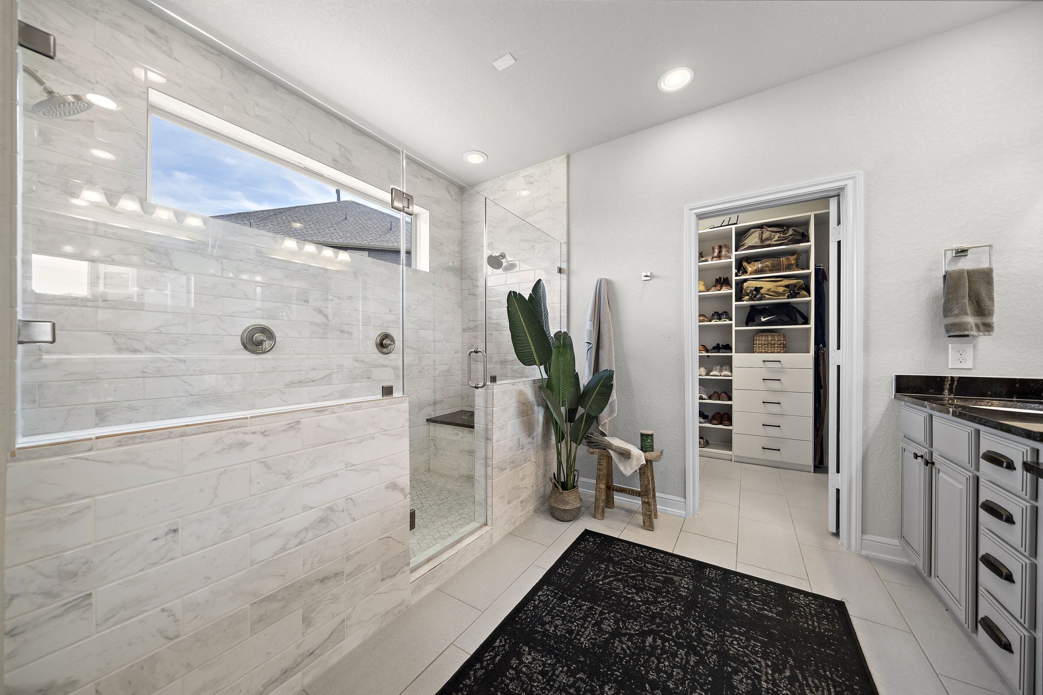19103 Heather Downs Court Cypress, TX 77429 - Photo 21 of 35 a bathroom with a bathtub and a shower