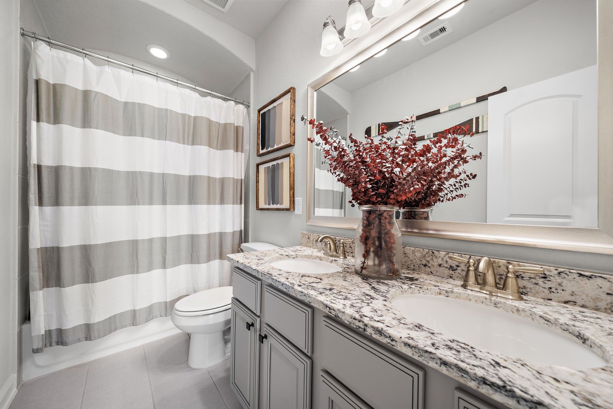 19103 Heather Downs Court Cypress, TX 77429 - Photo 25 of 35 a bathroom with a sink toilet and shower