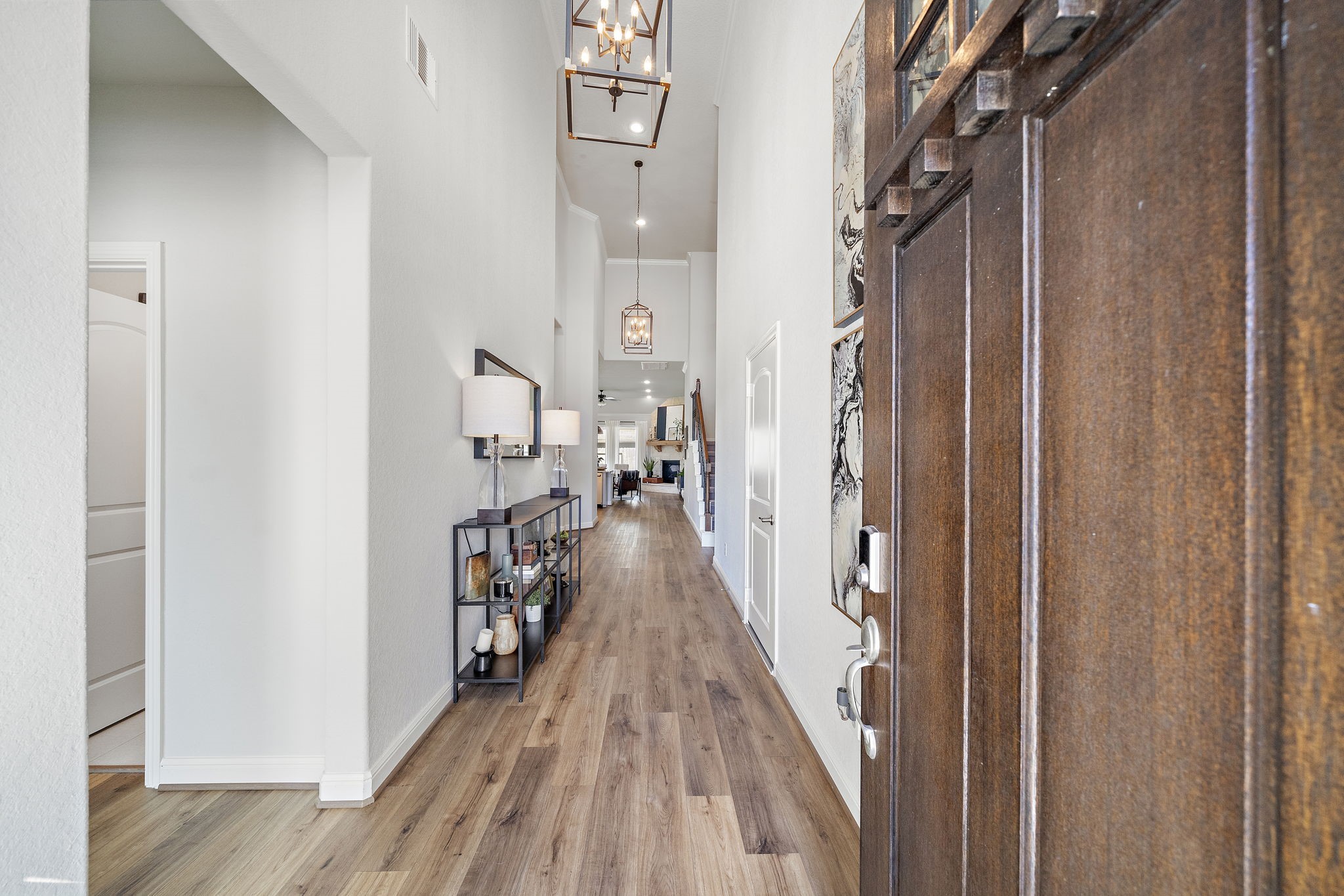 19103 Heather Downs Court Cypress, TX 77429 - Photo 3 of 35 a view of a hallway with wooden floor and staircase