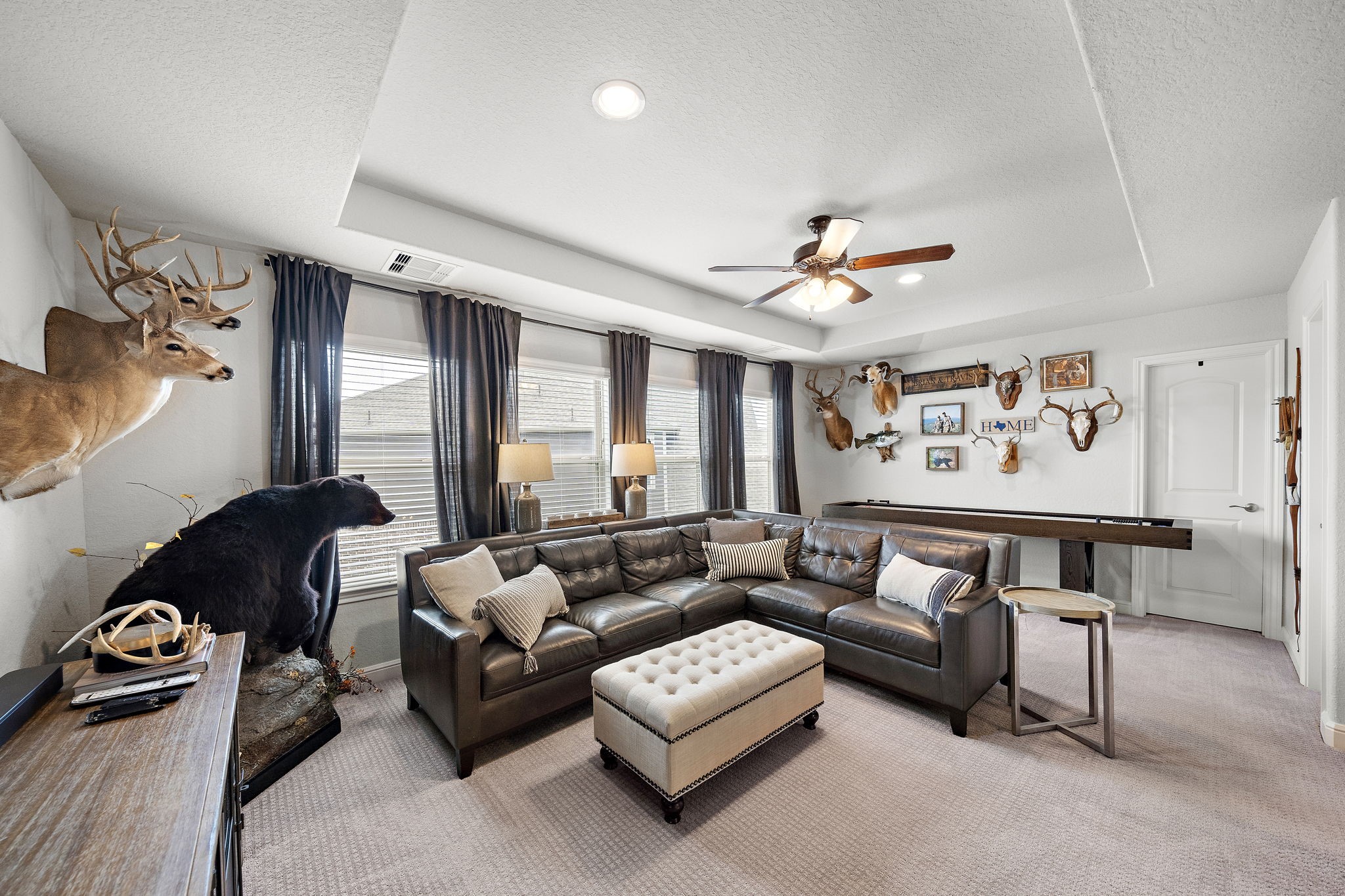 19103 Heather Downs Court Cypress, TX 77429 - Photo 31 of 35 a living room with furniture and a ceiling fan