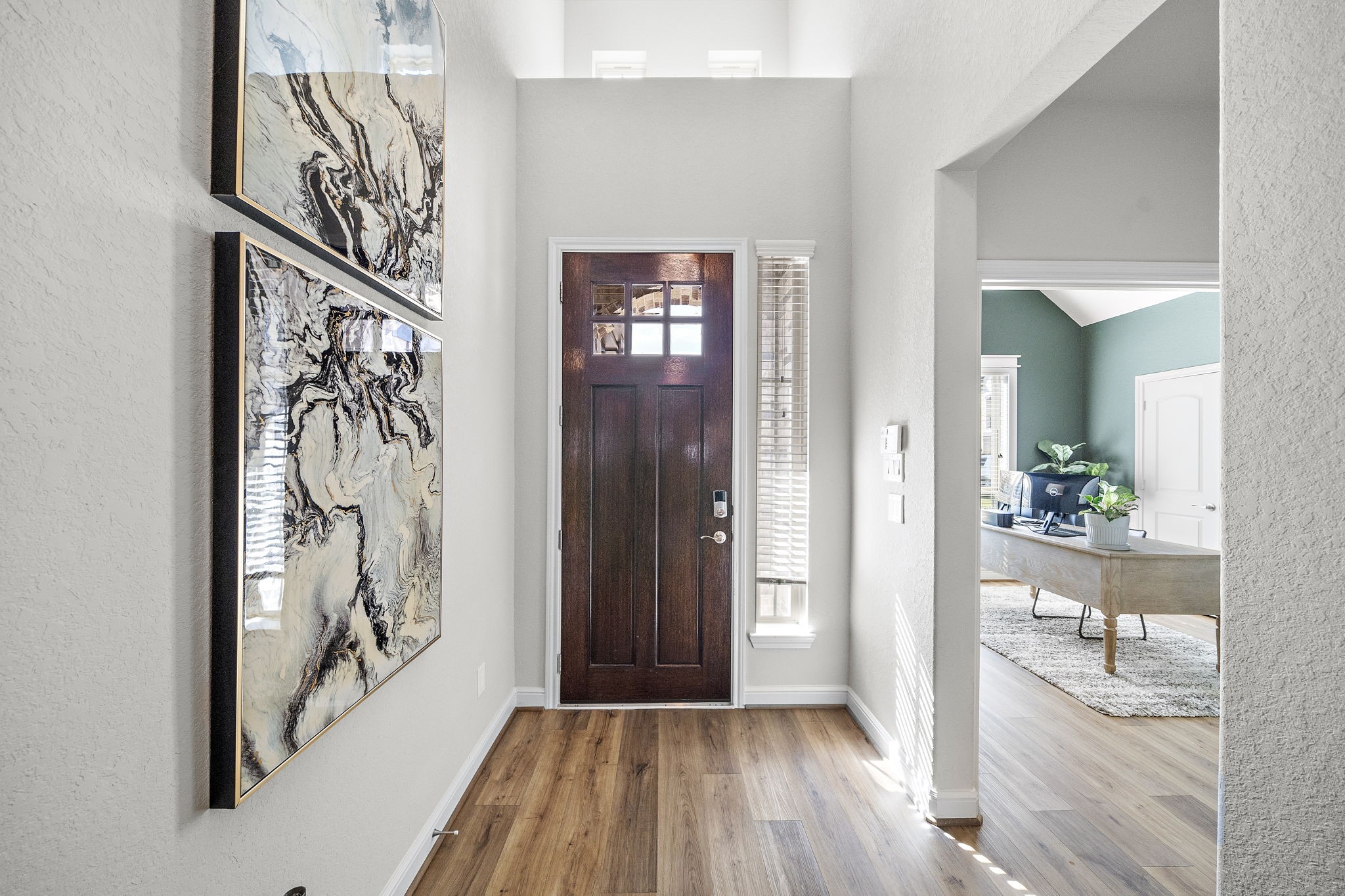 19103 Heather Downs Court Cypress, TX 77429 - Photo 4 of 35 a view of a hallway with wooden floor and a bathroom