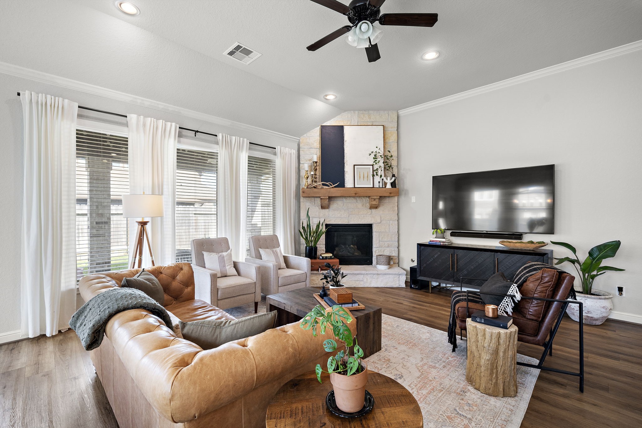 19103 Heather Downs Court Cypress, TX 77429 - Photo 5 of 35 a living room with furniture and a flat screen tv