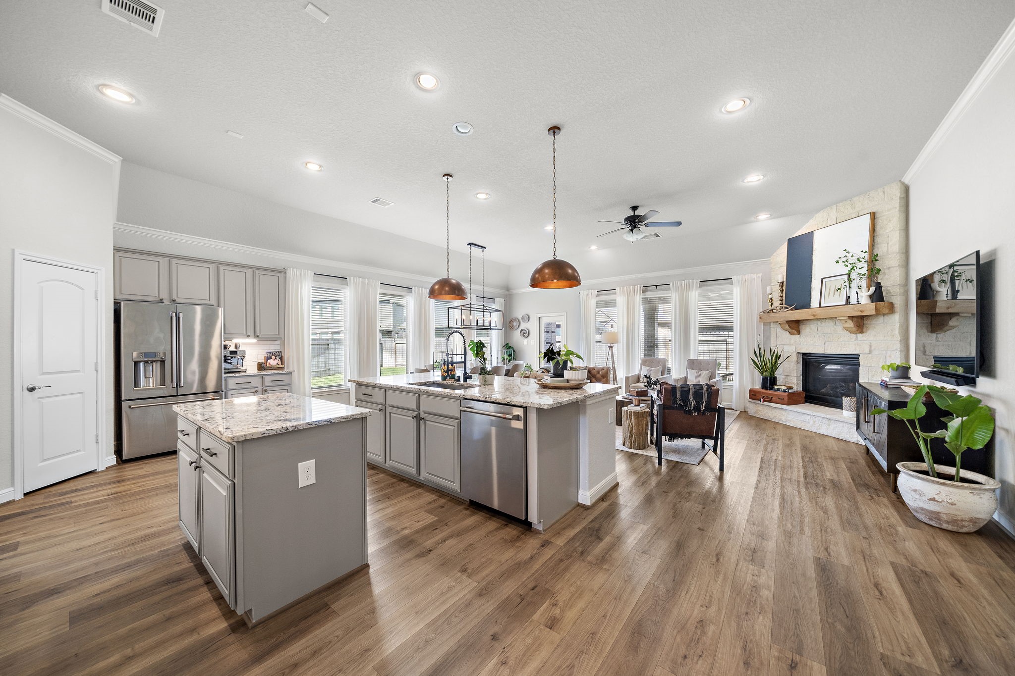 19103 Heather Downs Court Cypress, TX 77429 - Photo 10 of 35 a kitchen with stove and wooden floor