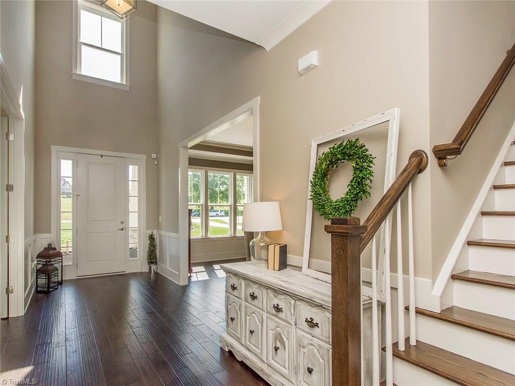 6807 Koala Drive Oak Ridge, NC 27310 - Photo 2 of 28 Wide plank Mohawk Mocha Hardwoods on BOTH levels.