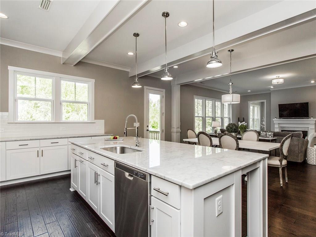 6807 Koala Drive Oak Ridge, NC 27310 - Photo 16 of 28 Recessed lighting everywhere. Side door lets out to huge deck.