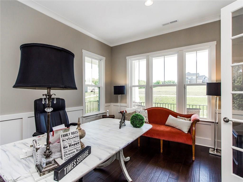 6807 Koala Drive Oak Ridge, NC 27310 - Photo 3 of 28 1st floor office space with views out to wrap around ROCKER FRONT PORCH.