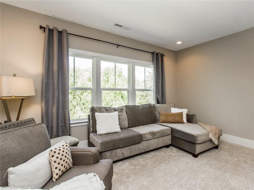 6807 Koala Drive Oak Ridge, NC 27310 - Photo 23 of 28 2nd story bonus room can remain as TV room, could be a theater, exercise space, craft room, playroom or anything else one could imagine. Completely private rear views and recessed lighting.