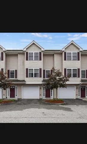 a view of a house with large windows