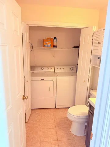 a bathroom with a sink a toilet and a shower