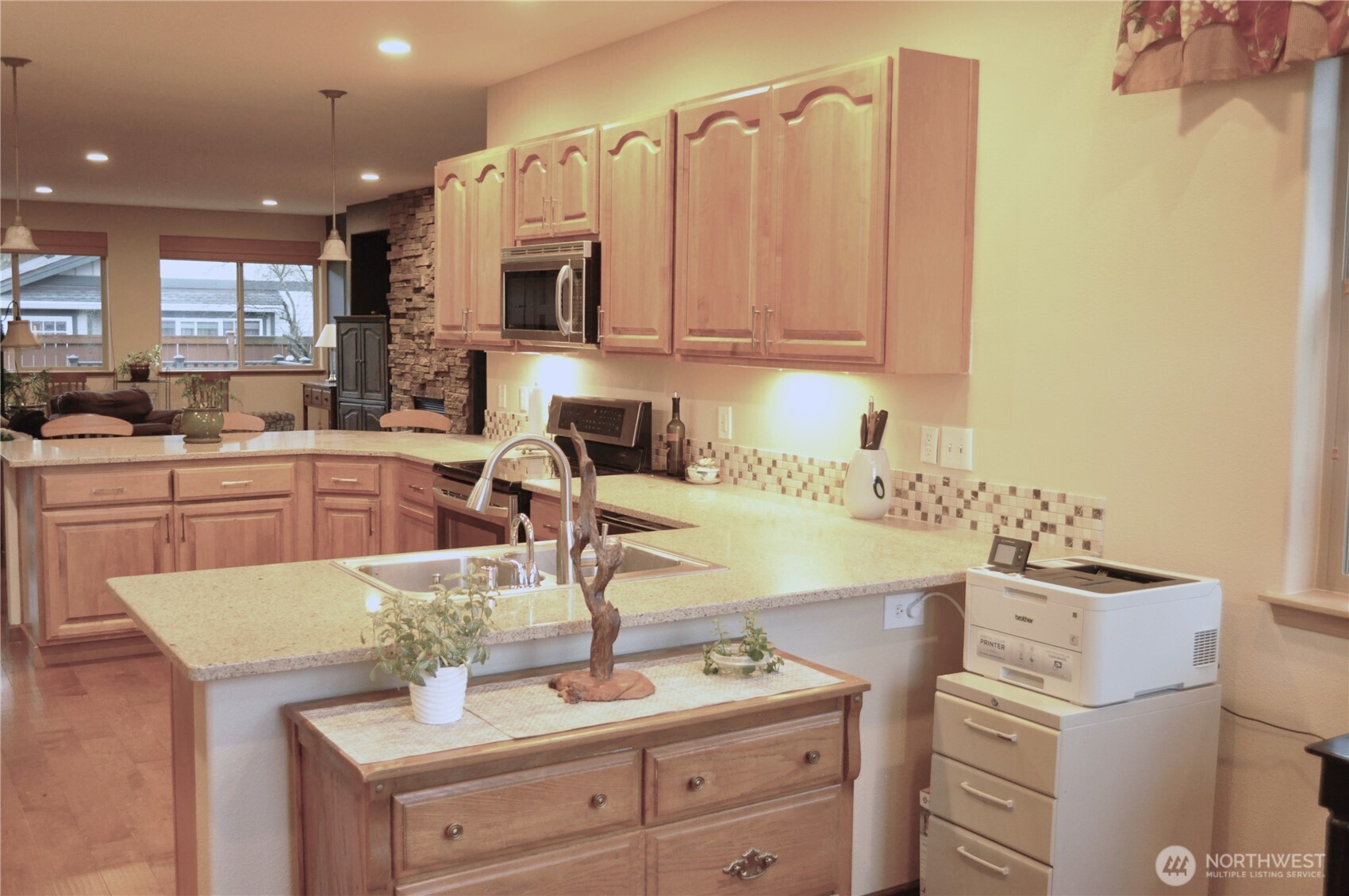 8650 Bainbridge Loop Northeast Lacey, WA 98516 - Photo 17 of 34 a kitchen with a sink cabinets and window