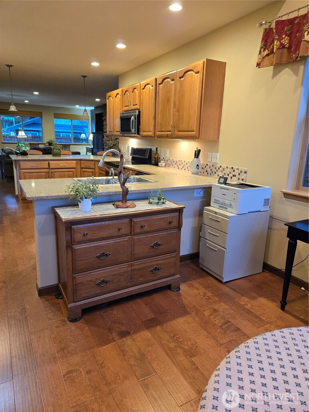 8650 Bainbridge Loop Northeast Lacey, WA 98516 - Photo 18 of 34 a kitchen with a refrigerator and a sink