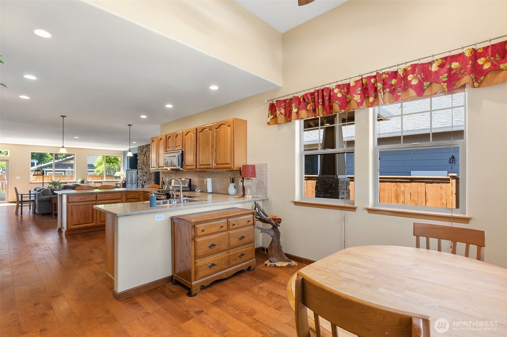 8650 Bainbridge Loop Northeast Lacey, WA 98516 - Photo 19 of 34 a kitchen with sink refrigerator and cabinets