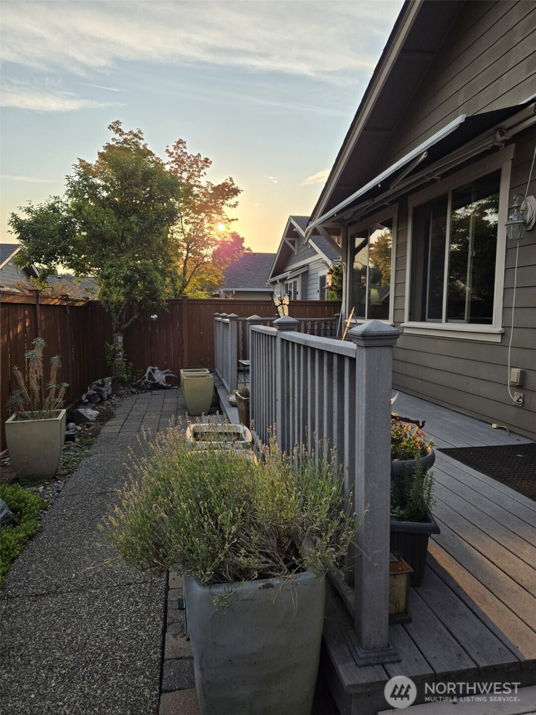 8650 Bainbridge Loop Northeast Lacey, WA 98516 - Photo 26 of 34 a backyard of a house with wooden floor yard and outdoor seating