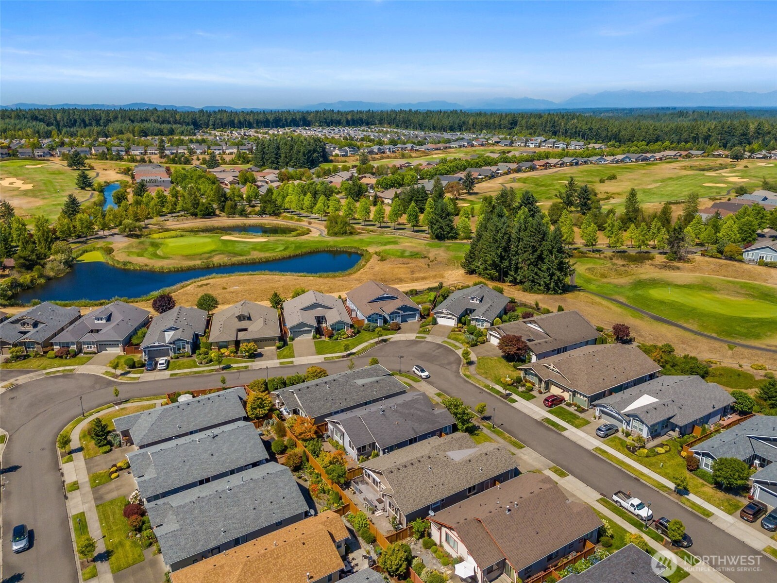 8650 Bainbridge Loop Northeast Lacey, WA 98516 - Photo 29 of 34 an aerial view of a city with a table and chairs