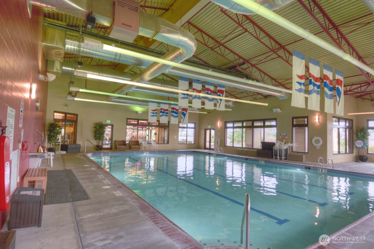 8650 Bainbridge Loop Northeast Lacey, WA 98516 - Photo 31 of 34 a view of a swimming pool with a outdoor seating