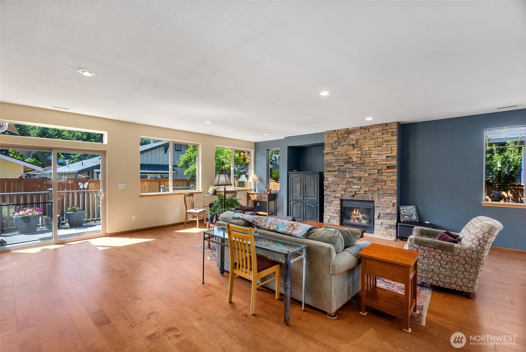 8650 Bainbridge Loop Northeast Lacey, WA 98516 - Photo 4 of 34 a living room with furniture and a fireplace