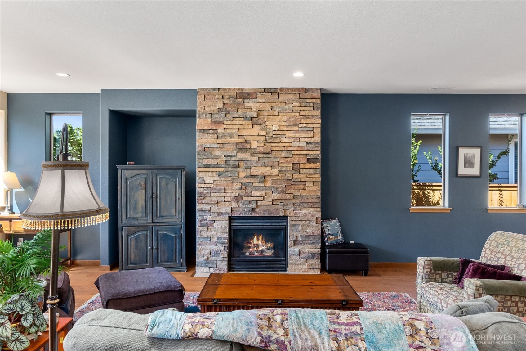 8650 Bainbridge Loop Northeast Lacey, WA 98516 - Photo 5 of 34 a bedroom with a bed and a fireplace