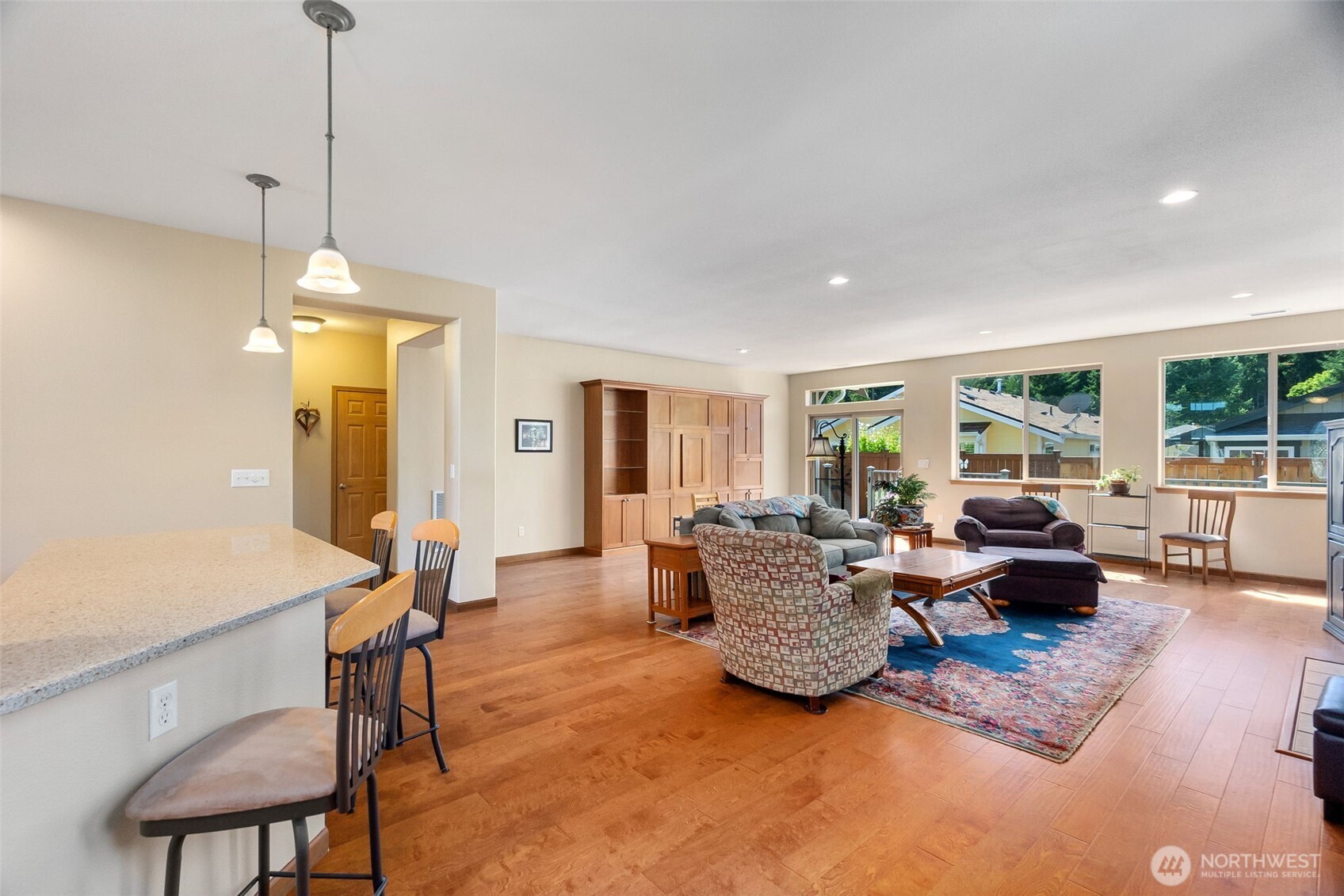 8650 Bainbridge Loop Northeast Lacey, WA 98516 - Photo 7 of 34 a living room with furniture and a chandelier