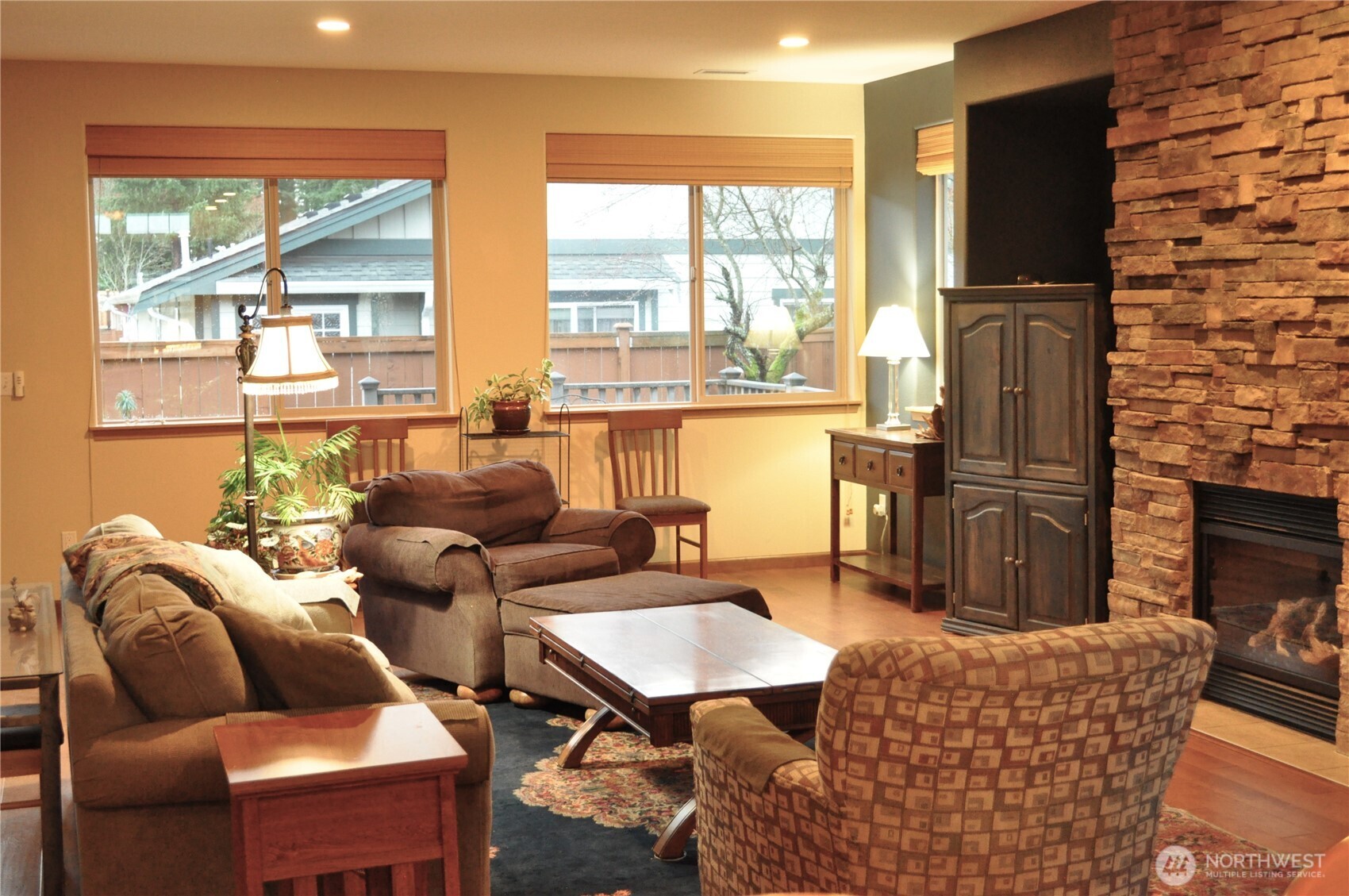 8650 Bainbridge Loop Northeast Lacey, WA 98516 - Photo 8 of 34 a living room with furniture and a floor to ceiling window