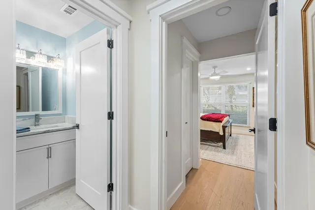 a kitchen with a sink and a mirror