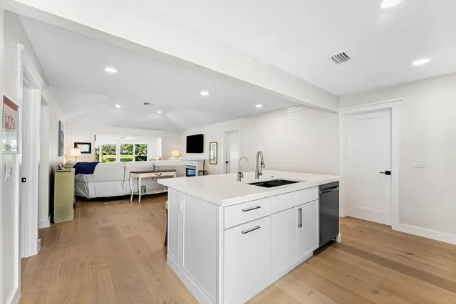 a view of living room with furniture and flat screen tv