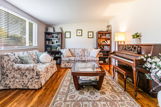 1619 Davis Drive Layton, UT 84041 - Photo 6 of 27 Living area featuring wood flooring, a large window with blinds.
