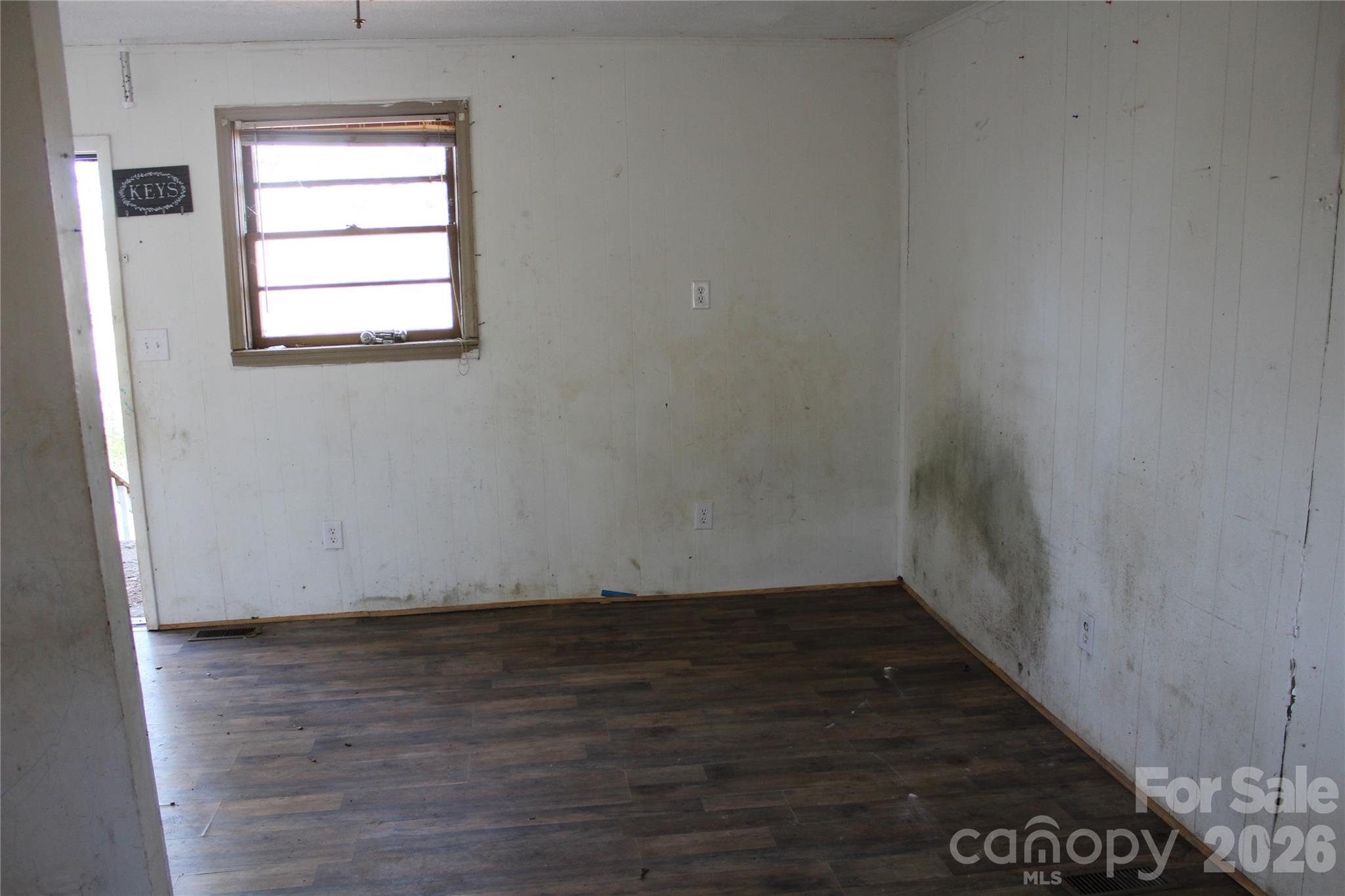 1617 Red Road Shelby, NC 28152 - Photo 17 of 21 an empty room with wooden floor and windows