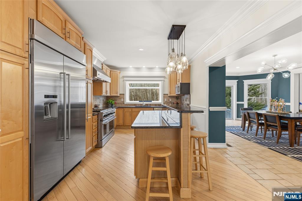 73 Big Piece Road Fairfield, NJ 07004 - Photo 11 of 45 a view of a kitchen and dining room