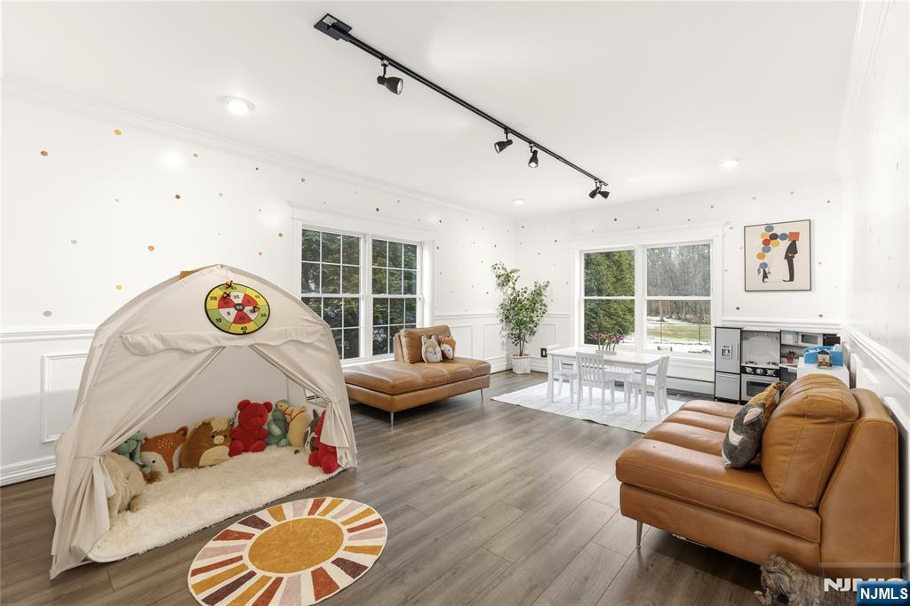 73 Big Piece Road Fairfield, NJ 07004 - Photo 13 of 45 a bedroom with furniture and a large window