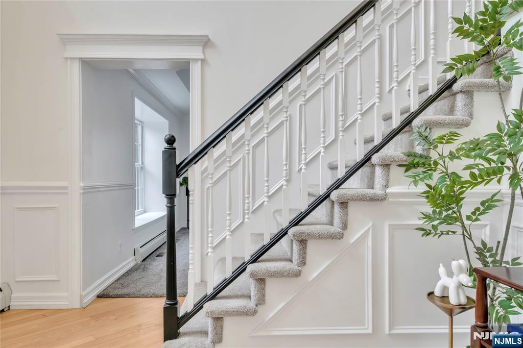 73 Big Piece Road Fairfield, NJ 07004 - Photo 17 of 45 a view of entryway with wooden floor and stairs