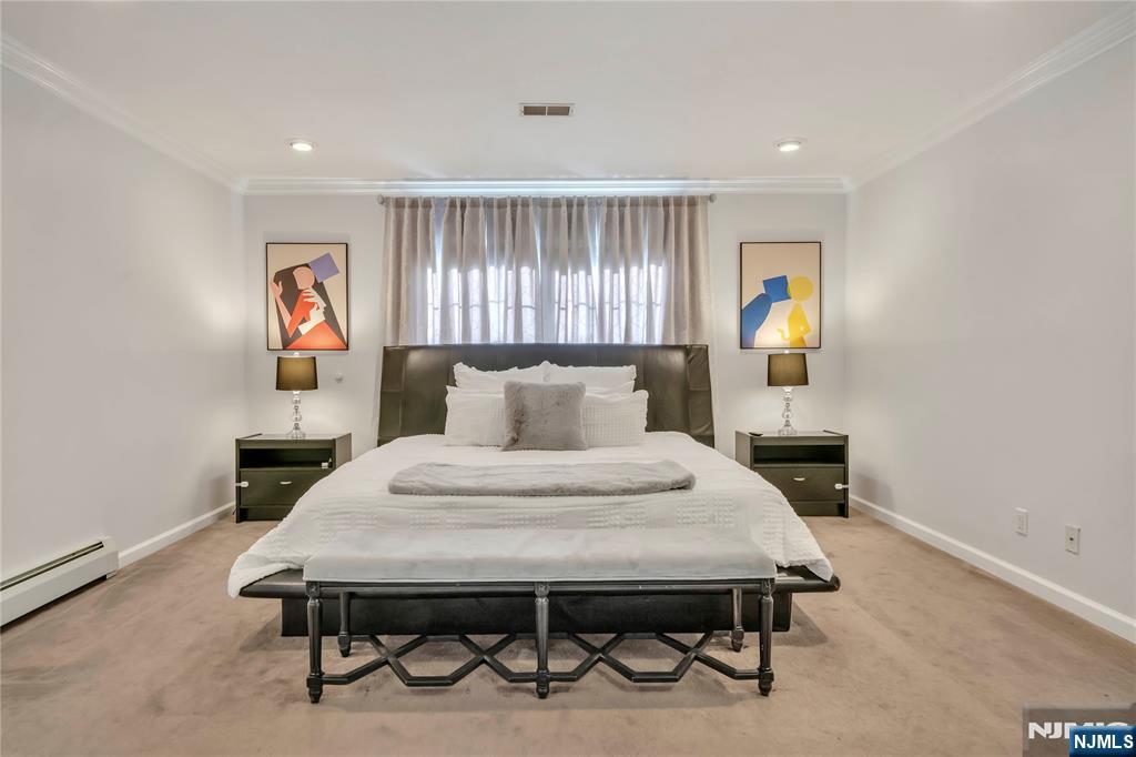 73 Big Piece Road Fairfield, NJ 07004 - Photo 20 of 45 a bed room with a bed and a window