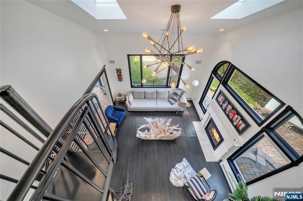 73 Big Piece Road Fairfield, NJ 07004 - Photo 28 of 45 a living room with furniture and a window