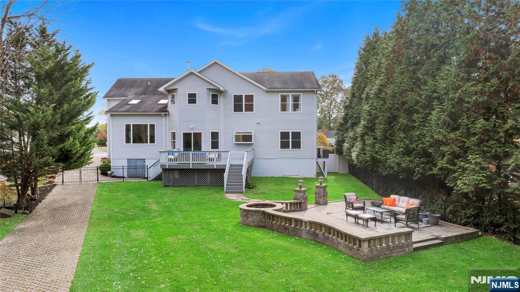 73 Big Piece Road Fairfield, NJ 07004 - Photo 38 of 45 a front view of a house with garden