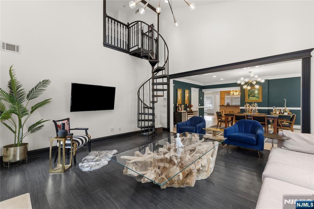 73 Big Piece Road Fairfield, NJ 07004 - Photo 4 of 45 a living room with furniture or wooden floor and a flat screen tv