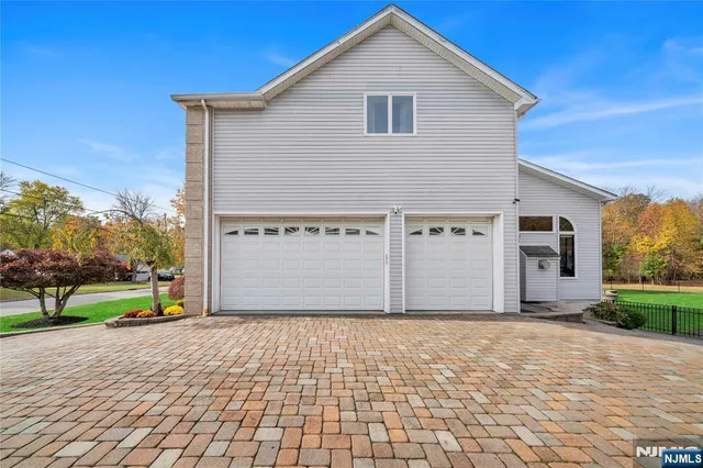 a front view of building with yard