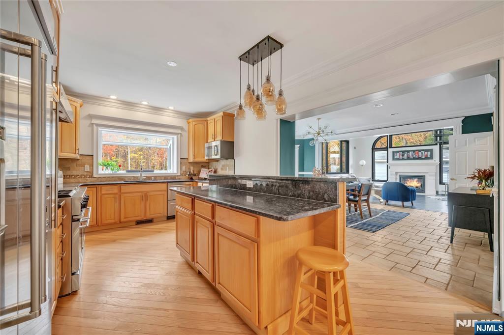73 Big Piece Road Fairfield, NJ 07004 - Photo 9 of 45 a kitchen with stainless steel appliances granite countertop a stove and a sink