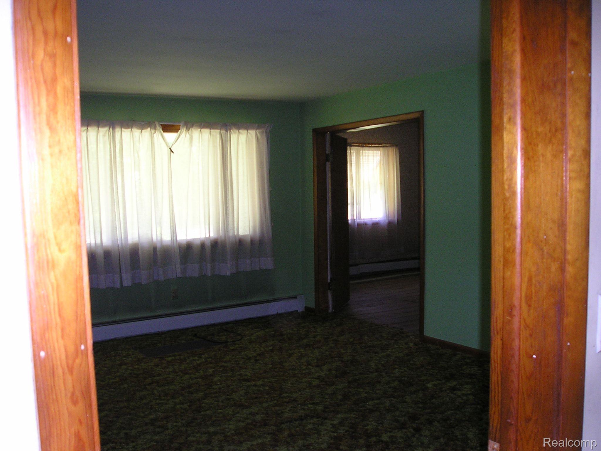 4249 East Hunters Creek Road Metamora, MI 48455 - Photo 9 of 19 Living room is L-shaped. Dimensions approx.